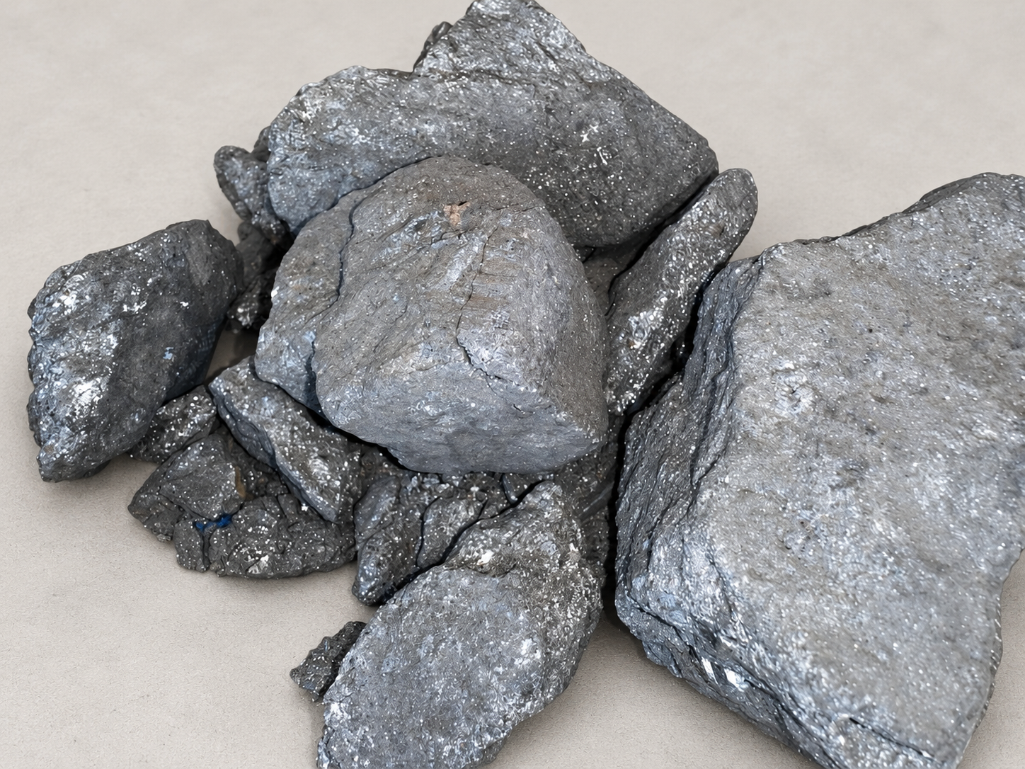 Supplied antimony ore photograph with an AI-edited neutral background.